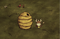 Wigfrid standing next to a Gigantic Beehive.